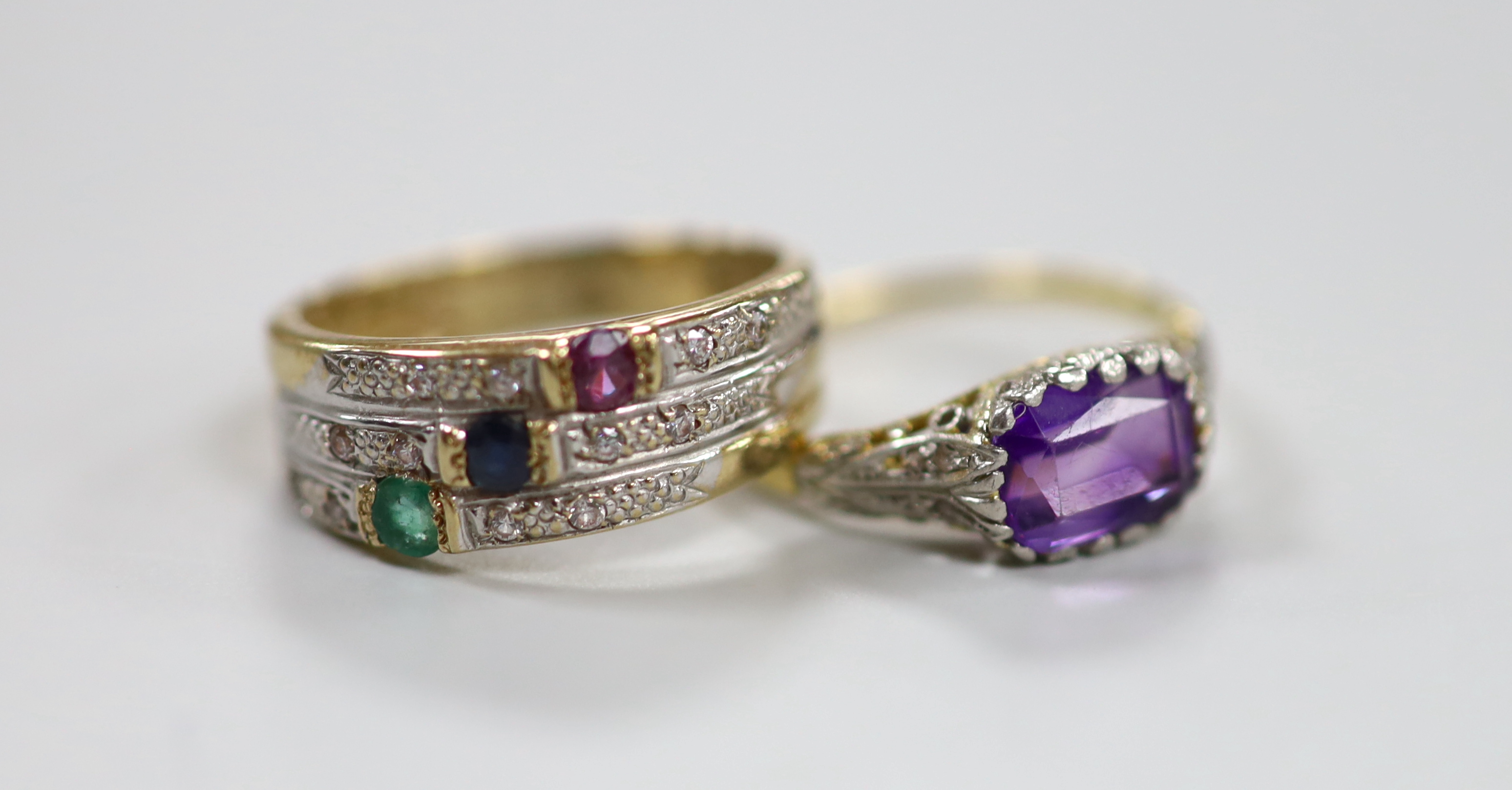 A yellow metal, and single stone amethyst set ring, with diamond chip set shoulders, size O and a yellow metal and cubic zirconia cluster set ring, gross weight 5.2 grams.